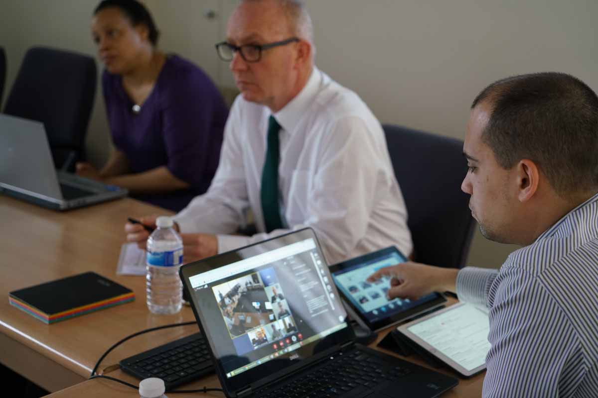 Wederly Aguiar manages the TED's new video conferencing facility for six off-site participants.  Images courtesy Trans-European Division / Victor Hulbert