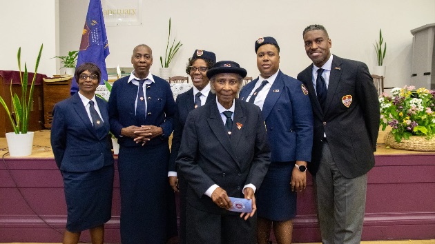 (Left to right) Donnette Brown, Joyan Johnson, Barbara McLaughlin, Karline Jones and Hewitt Grant. (Front) Dorcel Saul, being recognised for her service to the community. 