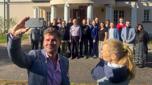 Daniel Kluska takes a selfie with the cohort
