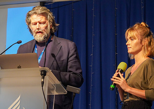 Dr Helgi Jónsson speaks during a session, accompanied by translator Patrycja Niewolik-Stupp