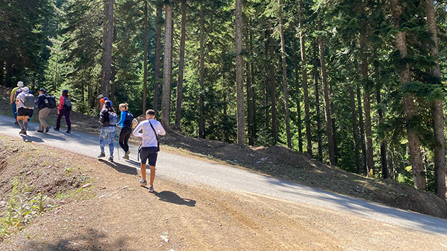 Young people hike through the trails of Liqenati in Kosovo’s Accursed Mountains during the September 2025 youth outing