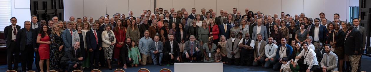 Executive Committee members, regular invitees and support staff gather for a group photo during the 2025 TED Annual Council