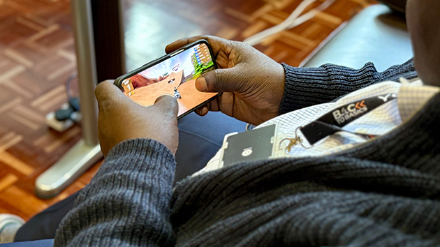 Kevin Johns plays the Crown of Life mobile game