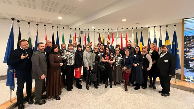 Members of the Latvian delegation stand together at the European Parliament Prayer Breakfast in Brussels, Belgium, on 3 December