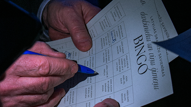 Attendees take part in an interactive game as they move around the room to find people who match different descriptions. The activity was designed to encourage conversation and help employees and family members get to know one another better