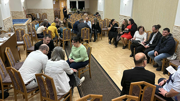 Church members share stories and connect during the afternoon fellowship programme, strengthening relationships over relaxed conversation