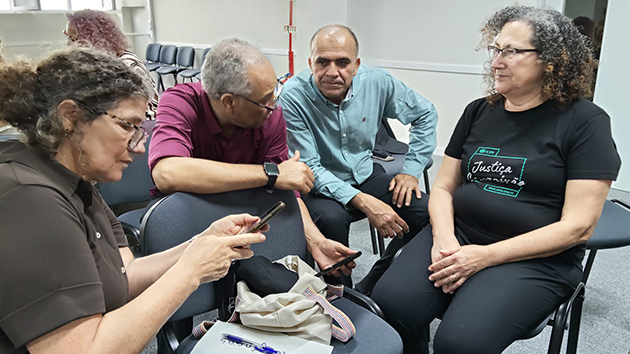 Participants work together in small groups during the Disaster Ready Churches training in Lisbon, Portugal