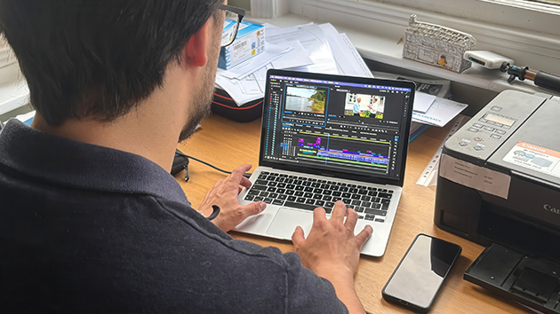 Video editor Edward Hilburn works on the post-production of In the Face of Revenge, using professional editing software to assemble the documentary’s footage