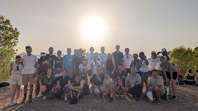 Attendees gather on the hillside behind Sagunto Adventist Campus to watch the total solar eclipse on 12 August