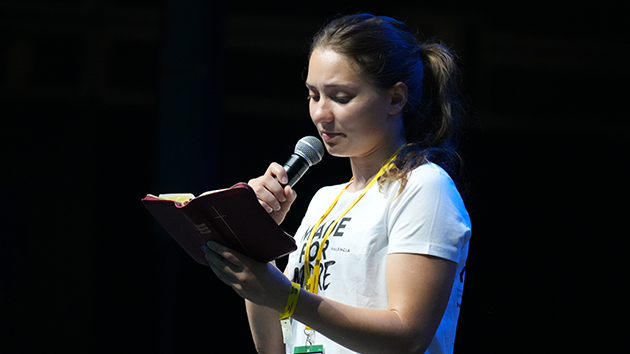 Participant Kreeta Helminen reads from the Bible in Finnish before the morning devotional on August 5