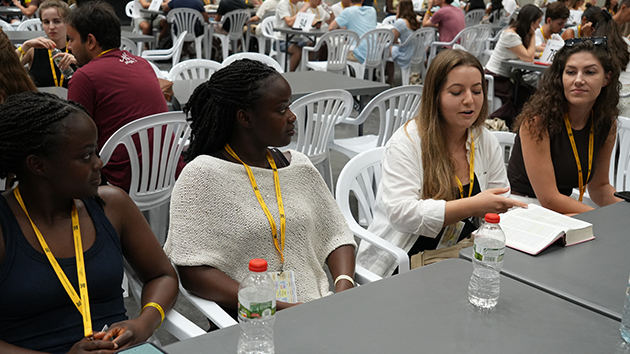 One of more than 300 small groups participates in a discussion on God’s call to Abraham as depicted in Genesis and Hebrews
