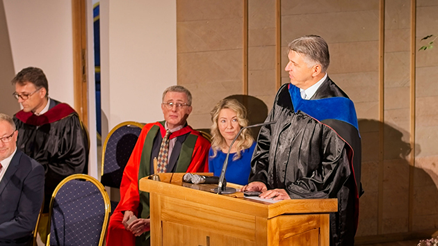 Dr Dragan Grujičić speaks at the graduation ceremony in Riga, Latvia