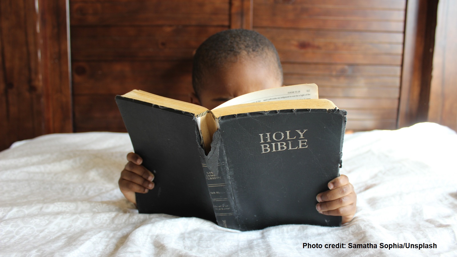 A boy reading the Bible